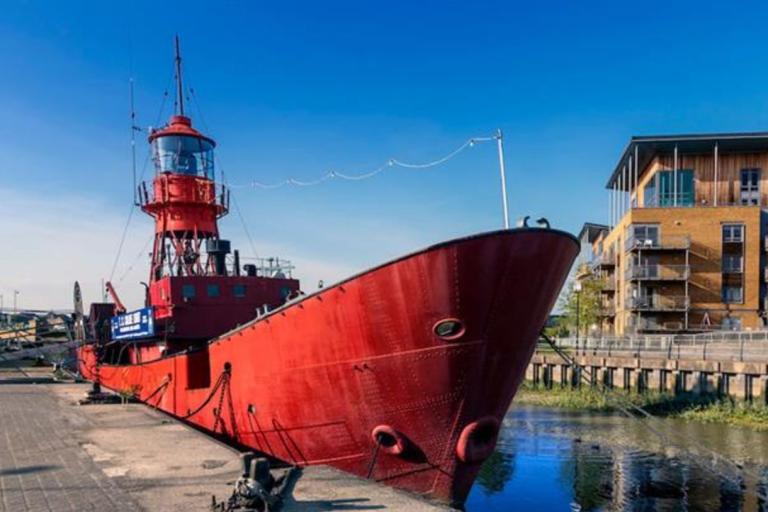 Red boat docked at the quay in Hythe Colchester on a sunny day