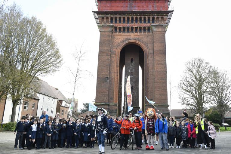 Beat the Street participants celebrate beneath Jumbo water tower