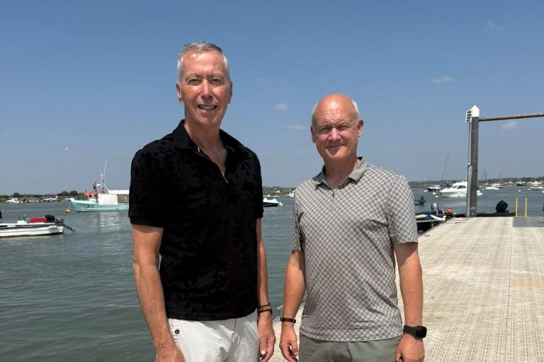 Cllr David King and Cllr Carl Powling pose on the pontoon at West Mersea