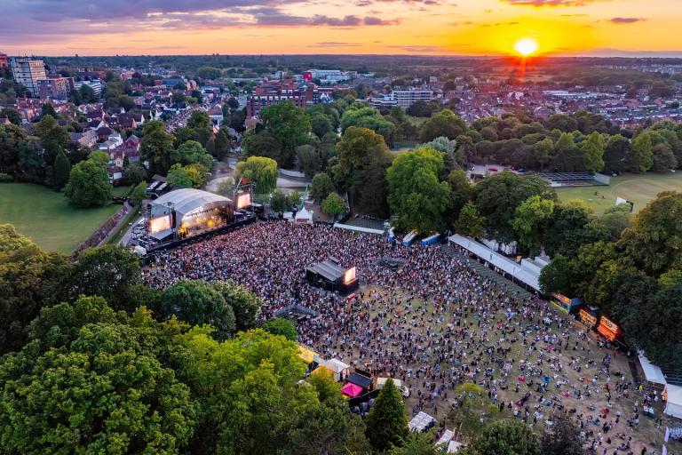 An aerial view of an open air concert in Lower Castle Park