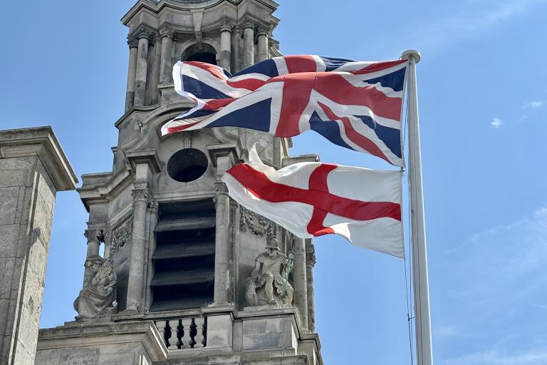 The Union Flag and Flag of St George flying from the top of Colchester Town Hall