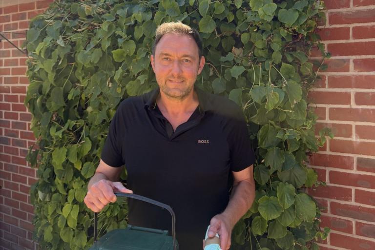 Cllr Martin Goss holding a food caddy