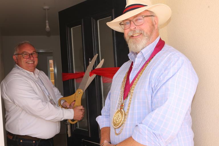 Cllr Rhys Smithson and Mayor Andrew Ellis mark the completion of the new properties