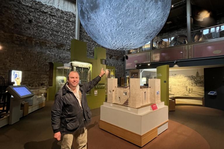 Cllr Darius Laws with Luke Jerrams' Museum of the Moon installation at Colchester Castle