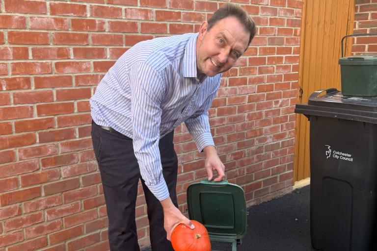 Cllr Martin Goss and a food waste bin