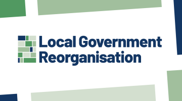 Logo with text “Local Government Reorganisation” in dark blue, next to a grid of green and blue rectangles on a white background with angled colour blocks.