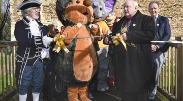 The Mayor and Town Crier cutting the ribbon outside Colchester Castle at the official launch of Beat the Street