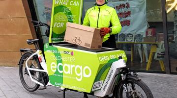 Emily Hughes standing next to an eCargo bike