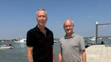 Cllr David King and Cllr Carl Powling pose on the pontoon at West Mersea