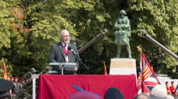 Mayor giving a speech at the unveiling of a Colchester Airborne Soldier Statue
