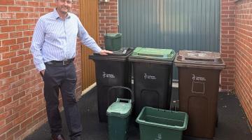 Cllr Martin Goss with recycling bins