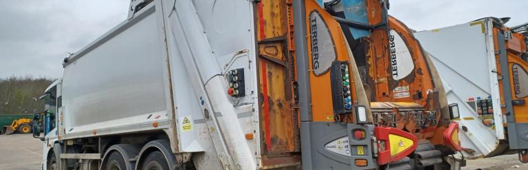 Photo of a recycling and rubbish refuse truck