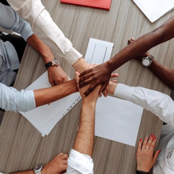 Different people of different ethnicities holding hands