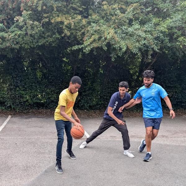 A group of young men playing basketball