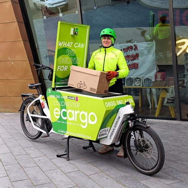 Emily Hughes standing next to an eCargo bike