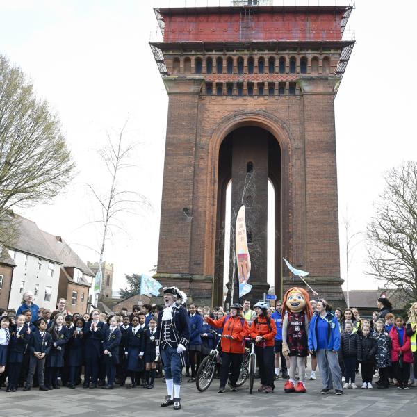 Beat the Street participants celebrate beneath Jumbo water tower