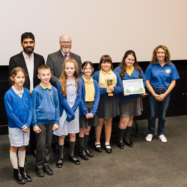 Overall Winners of Beat the Street Colchester 2026, Kendall Primary School photographed with Athelte, Wali Noori; Mayor of Colchester, Andrew Ellis and Director of Intelligent Health, Katherine Knight. 