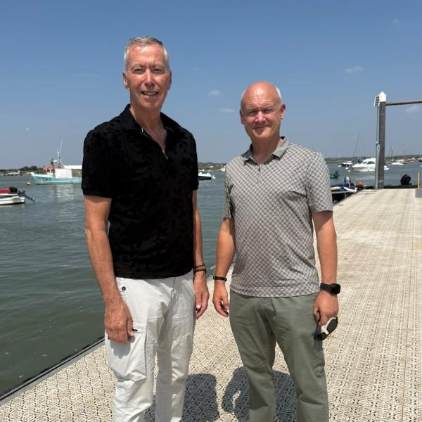 Cllr David King and Cllr Carl Powling pose on the pontoon at West Mersea