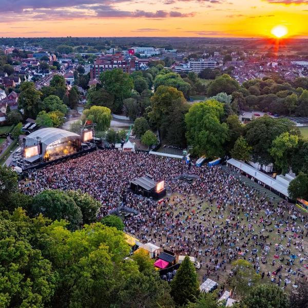An aerial view of an open air concert in Lower Castle Park