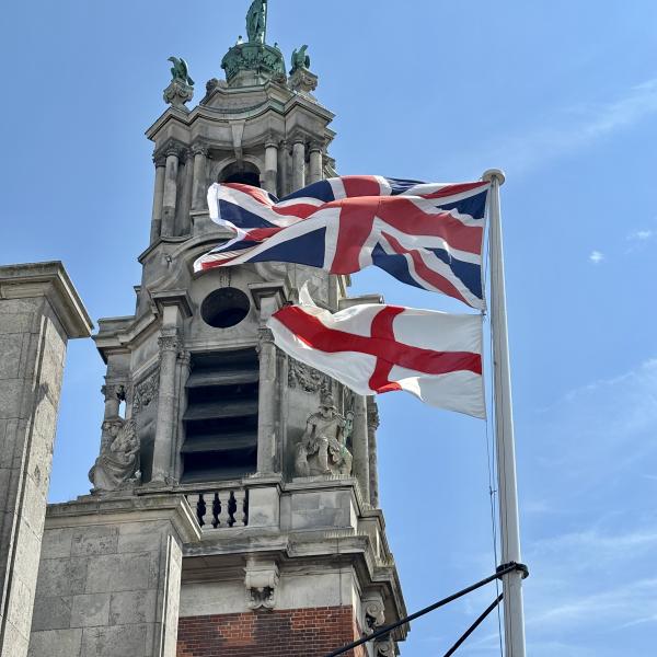 The Union Flag and Flag of St George flying from the top of Colchester Town Hall