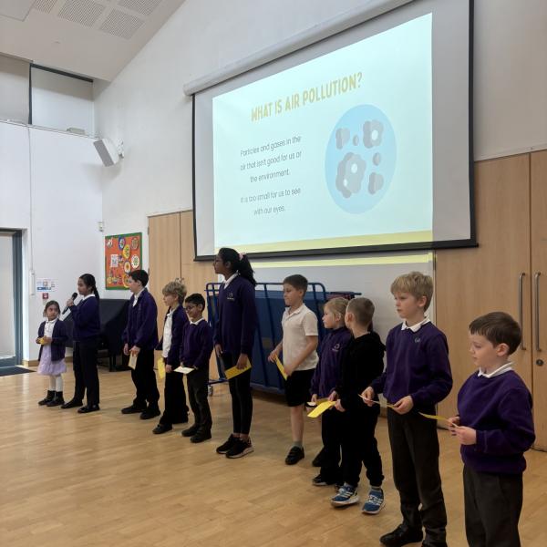 Children at Queen Boudica Primary School taking part in their Key Stage 2 air quality assembly.