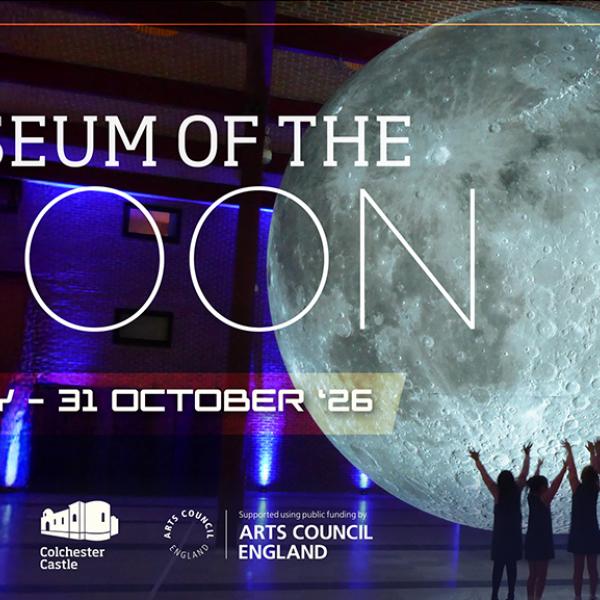 Promotional graphic for the exhibition “Museum of the Moon.” The image shows a giant illuminated model of the moon inside a large indoor hall with purple and blue lighting. Several people stand beneath the moon with their arms raised, emphasizing its scale. Large white text reads “MUSEUM OF THE MOON.” Below, the exhibition dates are displayed: “24 JULY – 31 OCTOBER ’26.” The venue features exposed beams and brick walls in the background. Decorative geometric lines and crossed marks frame the design.