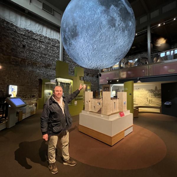 Cllr Darius Laws with Luke Jerrams' Museum of the Moon installation at Colchester Castle